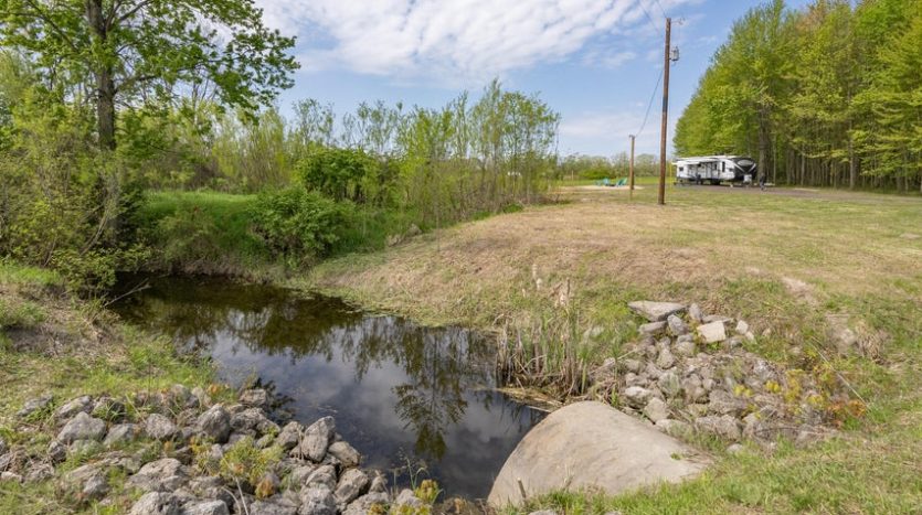 buildable level land with creek real estate
